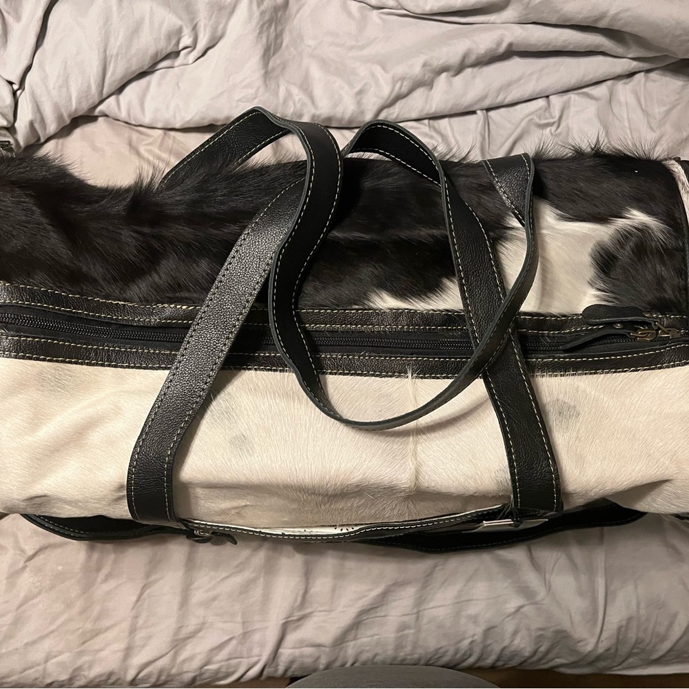 Brand new overnight bag. Black and white cowhide.